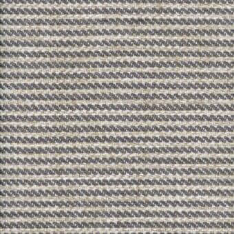 Woven fabric sample, beige and dark gray zigzag pattern, dense texture, matte finish, possible cotton-linen blend for upholstery.